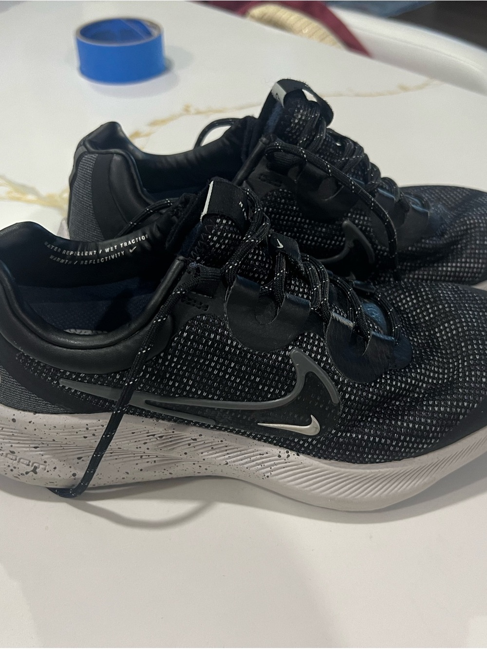 Nike Women’s Black and White Speckle Midsole Sneakers